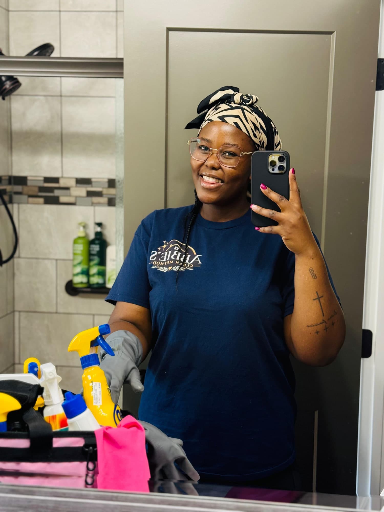 Abigail, founder of Abbie's Clean Method, with cleaning supplies